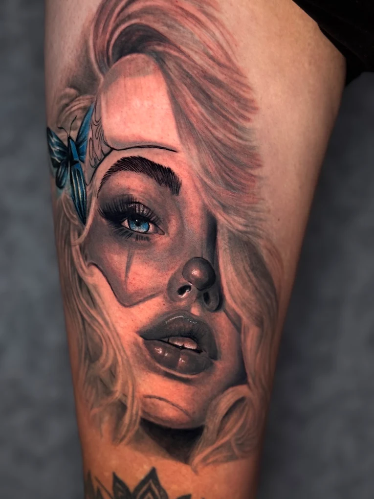 Colour realism portrait tattoo of a woman with a blue butterfly, by Joseph Bsaibess at El Artista realism tattoo studio in Hadath, Beirut